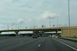 Florida's Turnpike passes under the Central Florida GreeneWay (SR 417) south ahead of Town Center Boulevard adjacent to the Falcon Trace development.