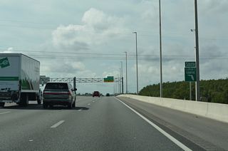 Florida's Turnpike crosses over the CSX Railroad, AMTRAK and SunRail beyond this confirming marker posted south of CR 527 (Orange Avenue).