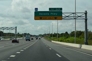 Exit 249 with Osceola County Road 522 (Osceola Parkway) is a diamond interchange. The arterial is a toll road west of Flora Boulevard en route to Walt Disney World.