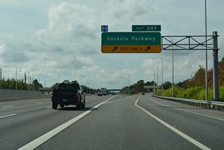 Tolls are charged on the southbound off-ramp at Exit 249 and on the northbound entrance ramp from Osceola Parkway. Osceola Parkway (CR 522) spans Florida's Turnpike with six overall lanes.