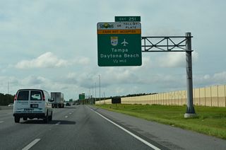 Florida's Turnpike advances south from the Southchase community to meet the Central Florida GreeneWay between the unincorporated communities of Hunters Creek and Meadow Woods.