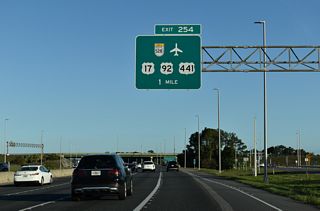 Exit 254 constitutes a trumpet interchange and access road linking the Turnpike with Orange Blossom Trail (OBT) directly and the Beachline Expressway east.