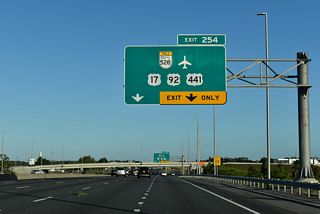 U.S. 17-92-441 (Orange Blossom Trail) pass underneath Florida's Turnpike just north of Exit 254. OBT constitutes a busy commercial arterial southward from Orlando into northern Osceola County.