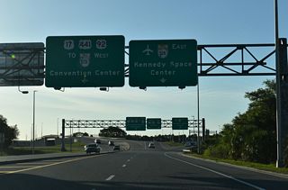 Ramps from both directions of the Turnpike combine ahead of the trumpet interchange with OBT. A direct ramp links with the Beachline Expressway eastbound to Orlando International Airport (MCO). The connection to SR 528 west requires using OBT south to Consulate Drive north.