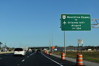 Exit 255 provides a direct ramp to Consulate Drive north of the Beachline Expressway over crossing. Consulate Drive links Southridge Commerce Park and SR 528 east with U.S. 17-92-441 (Orange Blossom Trail).