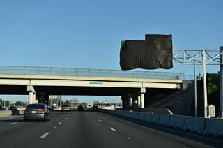 CR 423 (John Young Parkway) spans Florida's Turnpike just north of the new exit for SR 482 (Sand Lake Road). SR 482 is a major arterial running 7.73 miles between I-4 outside the Orlando city limits and SR 528 (Beachline Expressway) at Belle Isle.