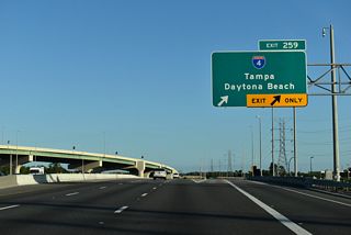 Florida's Turnpike southbound at the trumpet interchange (Exit 259) to Interstate 4. A connecting road directs traffic to a second trumpet interchange linking with I-4.