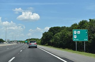Florida's Turnpike expands to eight overall lanes from Exit 272 southeast to south Orange County. Succeeding exits depart in quick succession from the southbound mainline in four miles for SR 429 (Daniel Webster Western Beltway) and SR 50 (W Colonial Drive).