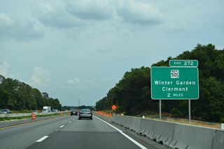 Florida's Turnpike curves eastward to Exit 272 for SR 50 (W Colonial Drive). SR 50 joins Oakland and Winter Garden with the annexed areas of Clermont to the west.
