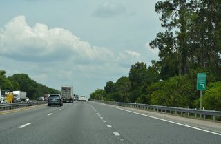 Florida's Turnpike crosses over SR 19 and plies across wetland areas associated with the Little Everglades beyond this confirming marker.
