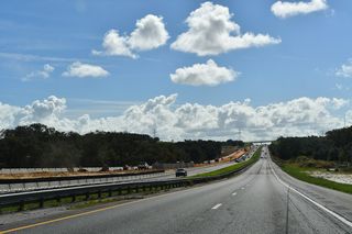 A long straight away along the Turnpike parallels U.S. 27 southeast between Montgomery and Schoolhouse Lakes. The two routes diverge beyond CR 561 near Shepherd Lake. Scrub Jay Lane spans the Turnpike south of mile marker 282.
