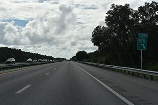 Florida's Turnpike passes east of Hampton Prairie and Clearwater Lake on the 6.8 miles to the succeeding exit.