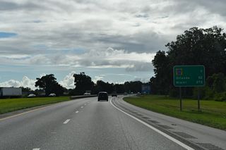 Continuing south, Florida's Turnpike next meets the Okahumpka Service Plaza followed by Exit 296 to County Road 470 in southwest Leesburg. 