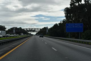 Turnpike Service Plazas are positioned every 45 minutes according to this sign along southbound between Exits 304 and 296. The facilities provide the main motorists services for 90 miles on the rural stretch between St. Cloud and Ft. Pierce.