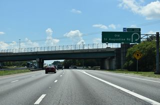 Entering the folded diamond interchange (Exit 335) with Old St. Augustine Road on I-95 south. Old St. Augustine Road arcs southeast from SR 13 (San Jose Boulevard) through Southside to U.S. 1 (Philips Highway) at Bayard.