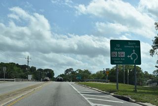 A roundabout connects SR 109 with Colcord Avenue east to the Arlington Expressway service road and SR 115 eastbound.