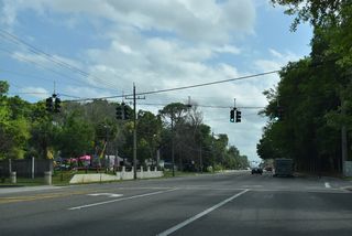 SR 109 (University Boulevard) commences south ahead of River Road to Jacksonville University.