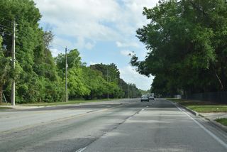 University Boulevard leads south from Charter Point and University Park to the University of Jacksonville. State maintained along the five lane boulevard previously commenced southbound ahead of Justina Terrace.