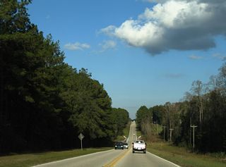 Construction in 2011 expanded the intersection with Juniper Avenue with left turn lanes. CR 215 lowers north from there across Bull Creek.