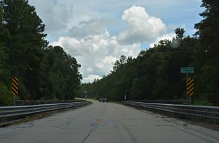CR 215 crosses the North Fork of Black Creek ahead of Rifle Range Road.