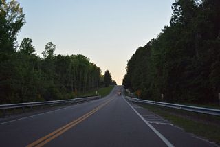 CR 215 proceeds south between rural residential areas at Deer Avenue before crossing Bull Creek for a second time.