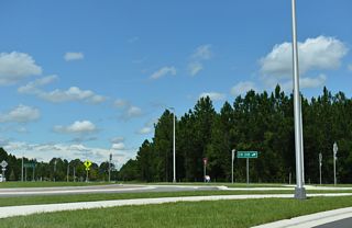 The roundabout with CR 218 includes a bypass lane from Cathedral Oak Parkway west for CR 218 north to Asbury Lake and Middleburg.