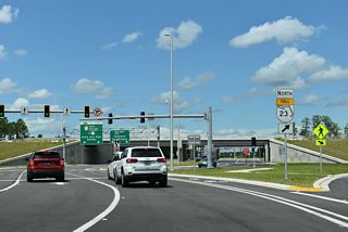Cathedral Oak Parkway westbound expands with two left turn lanes for SR 23 (First Coast Expressway) south.