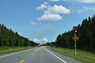 CR 218 meets Cathedral Oak Parkway (CR 216) at a roundabout constructed in 2025. The arterial route east to CR 315 opened to traffic on August 9, 2025 (Clay County, Florida, 2025).