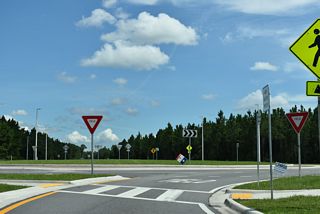 Cathedral Oak Parkway spurs west from the roundabout with CR 218 to an adjacent subdivision and church. East from CR 218, CR 216 meets the First Coast Expressway at a diverging diamond interchange (Exit 23).