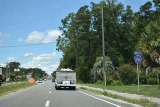 County Road 218 hooks west from SR 21 (Blanding Boulevard) ahead of Pine Tree Lane north to Everett Avenue (CR 220) and a shopping center.