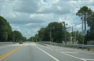 St. Clair Street links SR 230 with adjacent SR 100 before the route turns south from Madison Street toward Keystone Heights. E Call Street continues from there across Alligator Creek.