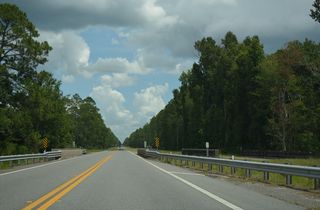 The second crossing of Alligator Creek along SR 230 east follows SE 11th Place.