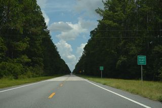 SR 230 enters Clay County and Camp Blanding Military Reservation 3.84 miles east of U.S. 301 in Starke.