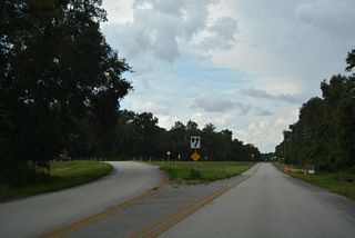 SR 16 overtakes SR 230 through Kingsley Village as the route encircles Kingsley Lake to the northwest.