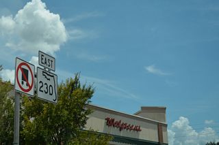 The first confirming marker for SR 230 east appears along W Call Street at U.S. 301 (Temple Avenue) ahead of Downtown Starke.