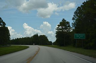 West Gate Road branches east from SR 230 to the West Gate of Camp Blanding.