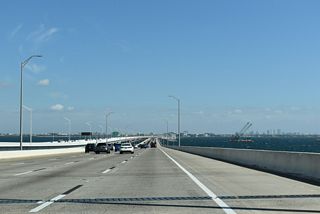 The original Howard Frankland Bridge opened in January 1960 as a four lane crossing for Interstate 4. This span permanently closed on July 9, 2025. As of January 2026, demolition of the 1960 span was 90% complete (FDOT, 2026).