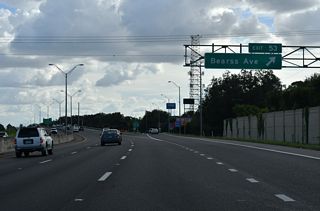 Entering the diamond interchange (Exit 53) with SR 678 (Bearss Avenue) on I-275 south. SR 678 overlays the half mile of Bearss Avenue linking U.S. 41 Business (Florida Avenue) and U.S. 41 (Nebraska Avenue). The arterial route extends west to Ehrlich Road and Northdale, and east to Bruce B. Downs Boulevard (CR 581) at New Tampa.