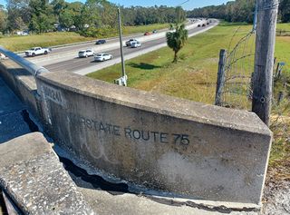 The Livingston Avenue overpass above I-275 was built as part of the original construction for Interstate 75. The bridge identification stamped at both ends of the span reference the crossing as Interstate Route 75.