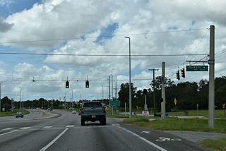 A traffic light with Rockhill Road north and the eastern section of Fowler Avenue into Thonotosassa precedes the ramp to SR 582 west.