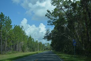CR 314A concludes north at a stop sign with CR 314 east of the rural community of Cedar Creek.