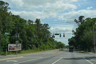 Traffic signals operate along SE 11th Street south at SE 4th Avenue.