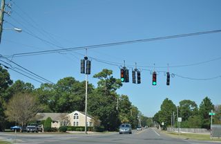 Airport Road proceeds northwest another 0.425 miles to the signalized intersection with 19th Street.