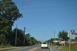 A commercial boulevard across the Panama City, SR 368 (W 23rd Street) converges with Airport Road beyond Lindenwood Drive.