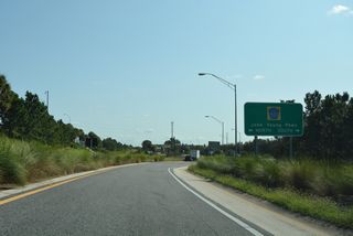 South through Hunters Creek, John Young Parkway continues from Hunters Creek to a commercialized SPUI with Osceola Parkway, and U.S. 192 in Kissimmee. Northward, CR 423 becomes SR 423 at Colonial Drive (SR 50) in Orlando.