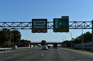 The University Mainline Toll Plaza was rebuilt in 2002-03 with two dedicated EPass / SunPass lanes in each direction. Completed on August 15, 2003, it was the first plaza along SR 417 to use open road tolling (Orlando Sentinel, 2003).