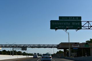 A slip ramp links the high-speed EPass lanes with the cash lanes ahead of a collector distributor roadway for University Boulevard.