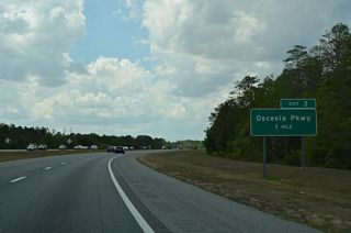 A parclo interchange (Exit 3) links the Central Florida GreeneWay with Osceola Parkway just across the Osceola County line. CR 522 follows the parkway east from Disney World to CR 530 (Boggy Creek Road).