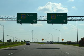 Exit 10 partitions into separate ramps for John Young Parkway south to Kissimmee and north to Orlando.