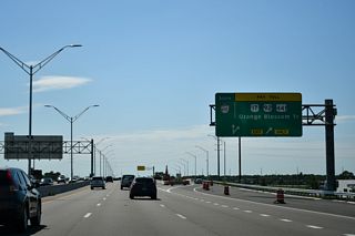 Exit 11 loops away from the southbound mainline to OBT. The often congested arterial heads north through an older commercial strip toward Edgewood and Pine Castle. U.S. 441 follows all of OBT northward to Mount Dora in Lake County.